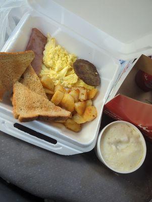 Eggs, grits, sausage, and toast. Perfect!