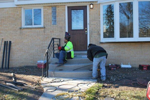 Concrete Front Step Removal and Replacement. New Custom made iron rails.