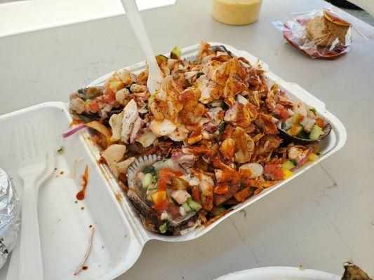 Aguachile mixtos with blood clams and mangoes