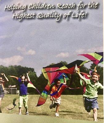 Children flying kites to reach for the highest quality of life