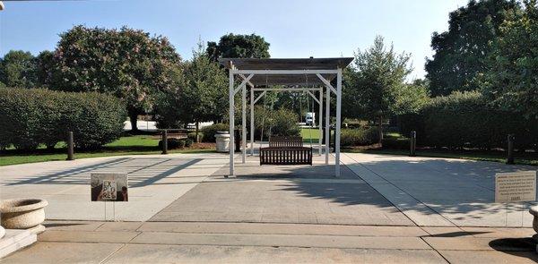 These are some swinging chairs that you can sit on at this welcome center.  Photo taken July 28, 2021.