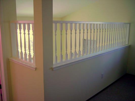 I custom built, installed & painted this railing so my client can put his desk against this wall without risking a toddler fall.