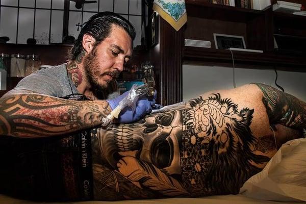 GUIDO BALDINI AT WORK ON A CUSTOM BACK PIECE