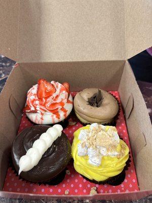 Front left clockwise: chocolate crème, banana pudding, vanilla with chocolate icing, strawberry shortcake