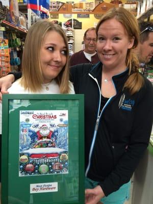 Diana and Caity Brunjes with the 2014 Christmas Parade award - Most Festive.