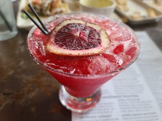 Blood orange jalapeño margarita: jalapeño infused tequila, lime juice, agave nectar, & a lime sugar rim.