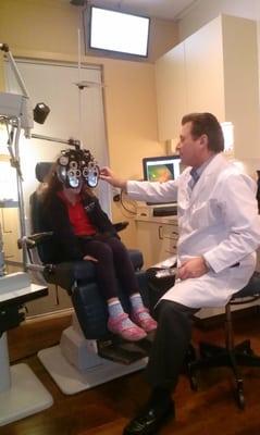 Dr. Bob doing an eye exam. He is excellent with kids.