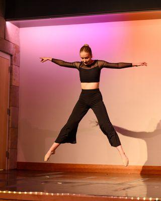 Dancer leaping onstage at our recital.