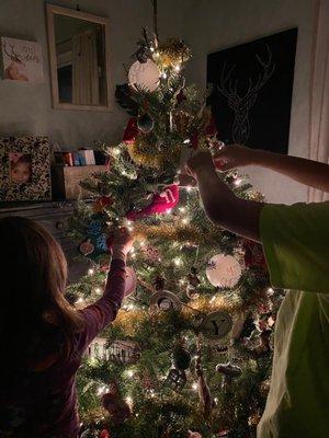 Tree from Danny's and kids putting final touches...