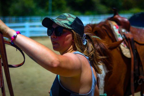 Trail guide preparing our horses for the ride