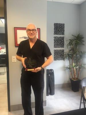 Dr. Newman with the Top Doc award