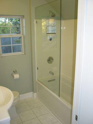 Small bathroom renovation.  Work included complete demolition, moving window and restructuring floor.