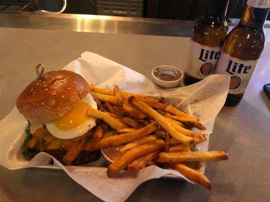 TRAINWRECK BURGER (left) FRIES (middle) COLD BEER (right)