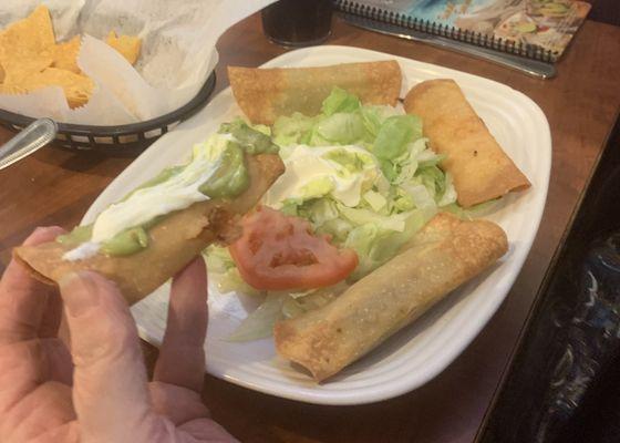 Taquitos Mexicanos. Two chicken and two ground beef. She said so wished she would have asked for shredded beef.