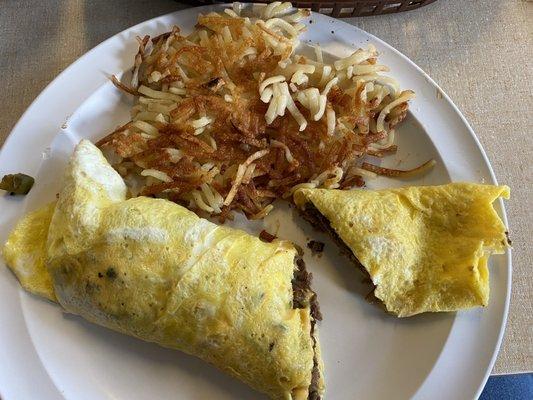 Philly cheesesteak omelette with hash browns. It might have 2 eggs but definitely not 3.