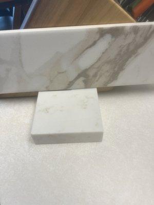 The backsplash alongside our new counter sample.