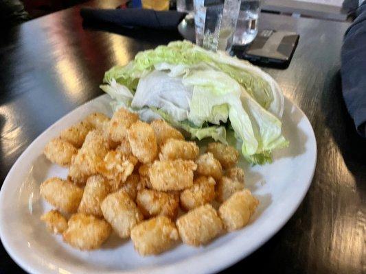 Lettuce wrapped burger with Truffle and salt seasoned tots.