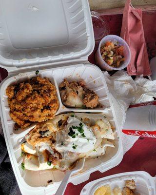 Enchiladas, pastele rice, and refried beans.