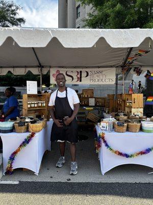 Our owner selling Sassi Beauty Products at Pride Parade