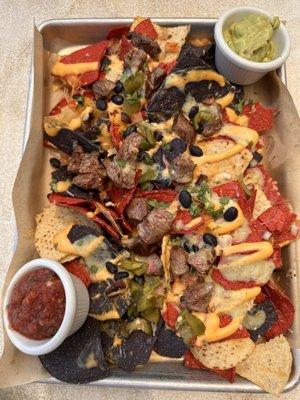 Beer Cheese Nachos with carne asada