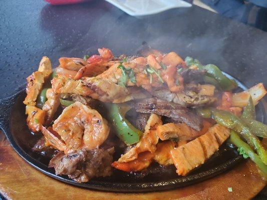 Chicken, steak and shrimp fajita