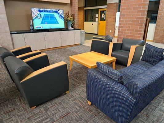 Inside lobby of Johnson Ranch Sports Club South - Large Screen TV set to US Open