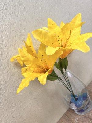 Yellow hibiscus (faux) on every table.