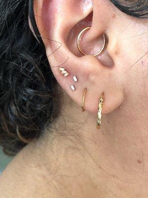 Top three lobe piercings by Josh (daith also by Josh from several years ago)