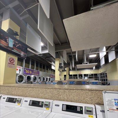 Right side by the street. Large laundry mat