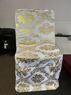 Chairs covers white spandex with gold.