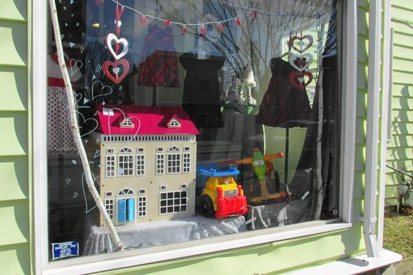 Feb front window showed Valentine day dresses and awesome doll's house and some toys