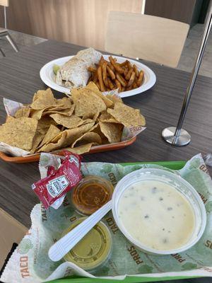 Barbacoa Burrito with fries. Chips and queso