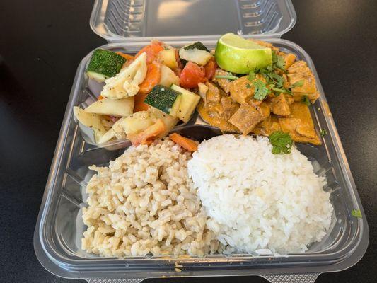 Two items rice plate with red curry chicken and steamed vegetables