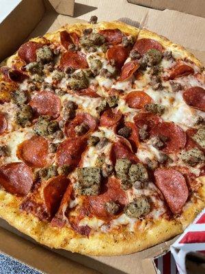 Medium pizza with pepperoni, sausage and ground beef