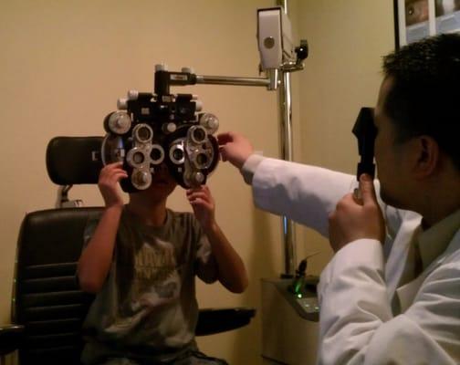 Jonah getting his eyes checked with Dr. Toy