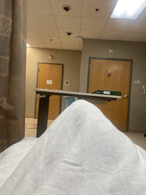 Waiting in the surgical prep area which was chaotic today ! I felt bad for The nurses so I didn't bitch or bother them