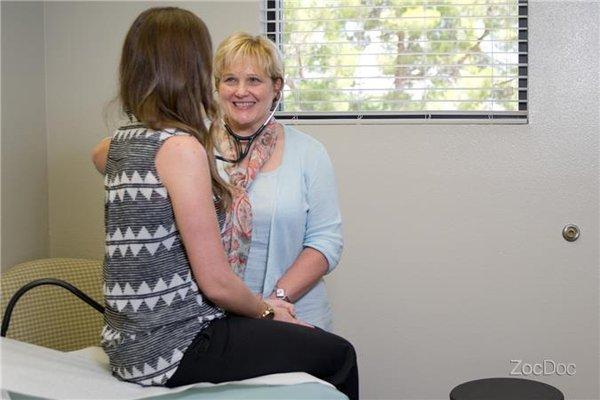 JoEllen Embry WHNP advising a patient.