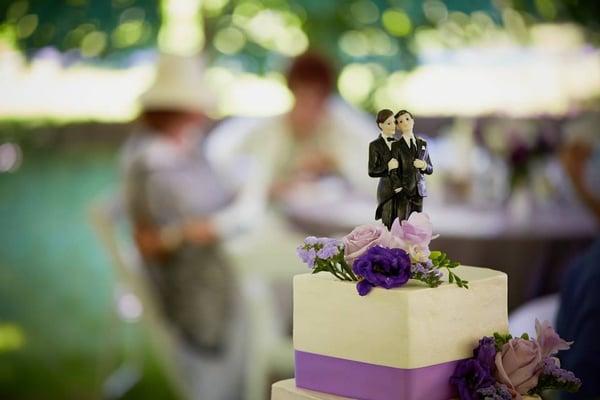 Two dapper gents top this delicious and beautiful cake