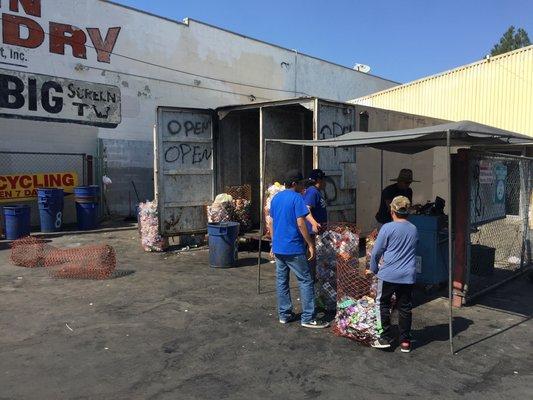 "Store front". Scale, cashier, and receptacles.