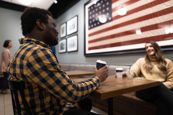 Couple Enjoying Coffee At Table