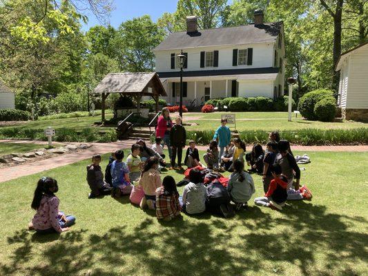 School children picnicking after a tour at Smith Plantation