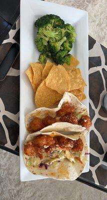 Firecracker shrimp, tacos with chips and broccoli