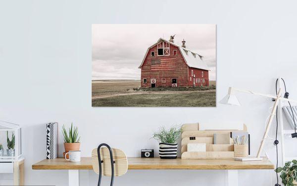 Photo of a red barn with the American flag