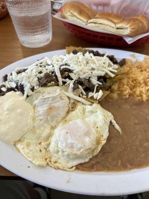 Chiliquiles con asada! Got my juevos over medium and some chili verde on the side.