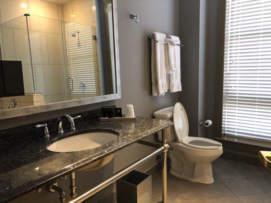 Large vanity with a TV in the mirror