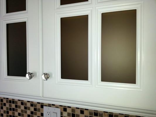 Frosted cabinet glass.