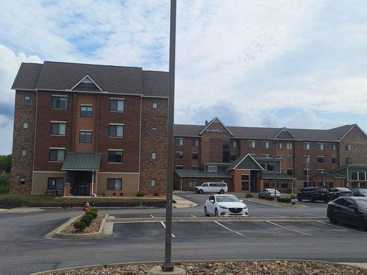 Exterior view w plenty of parking, including ev and handicapped spaces