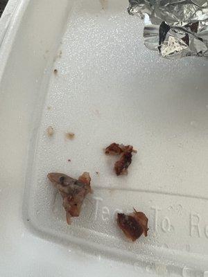 3 separate bone fragments in my black eyed peas and rice with the loose hair sitting on the biggest piece on the left side of the photo