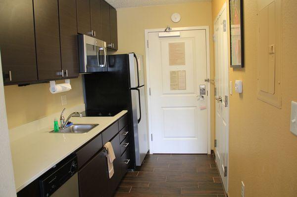 Full kitchen - full fridg.  LOVE the tile floors in the kitchen and bathroom.