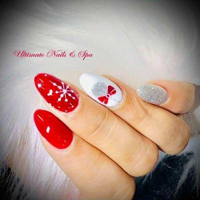 Embrace the holiday magic with festive ombre nails! From red to glittery white, your nails will sparkle like Christmas lights. 
 Book